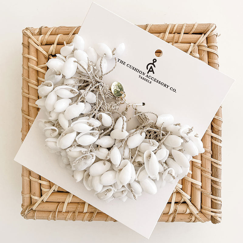 WHITE CUSHION AND SHELL TASSELS